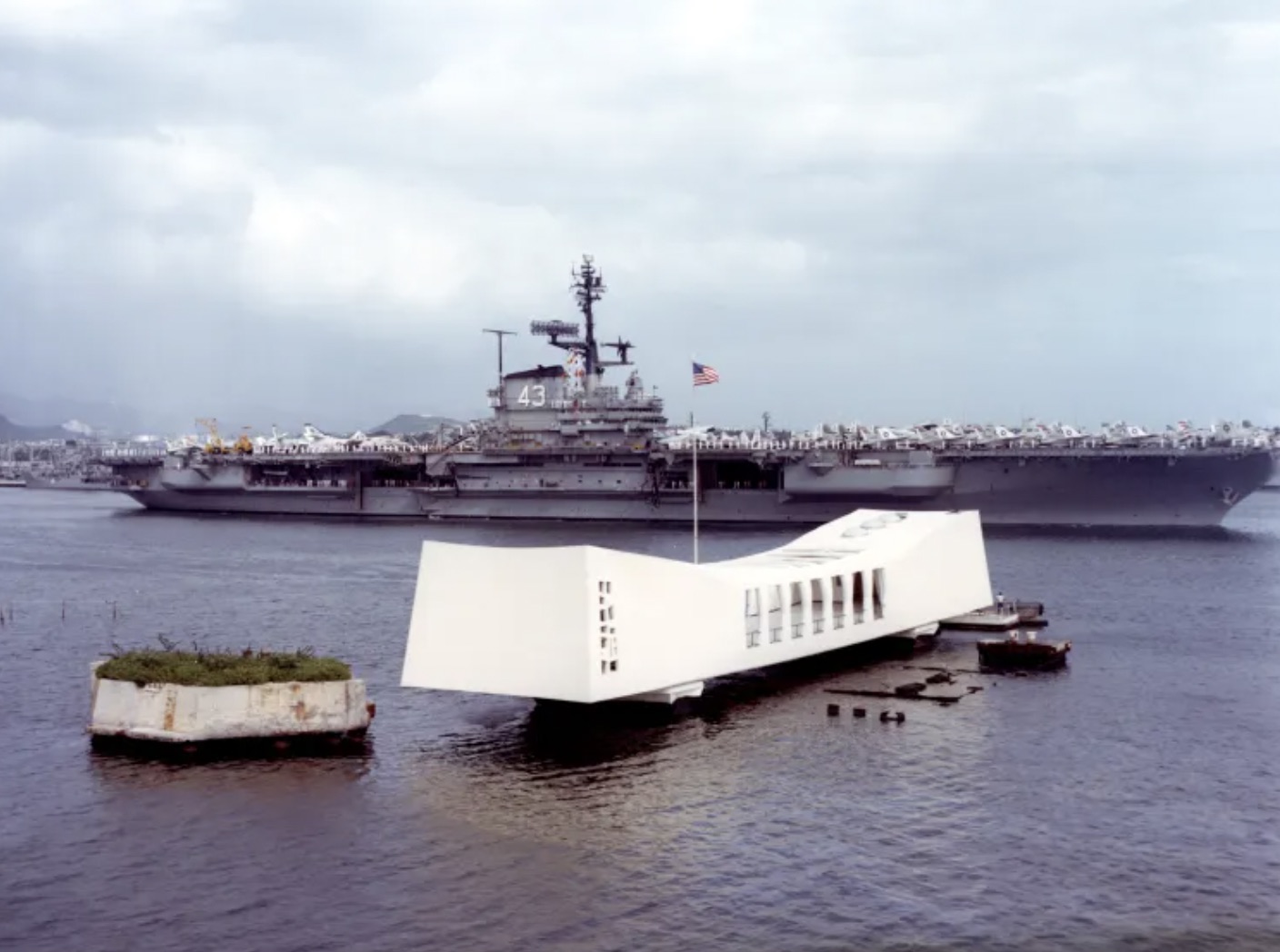 The USS Coral Sea photographed behind the USS Arizona Memorial 